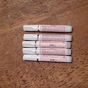 Unopened bottles of glamnetic nail glue
